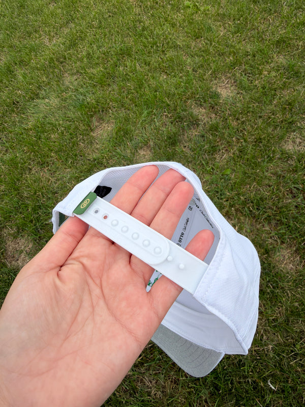White cap with green logo