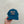 Teal cap with peach logo