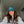 Teal cap with peach logo
