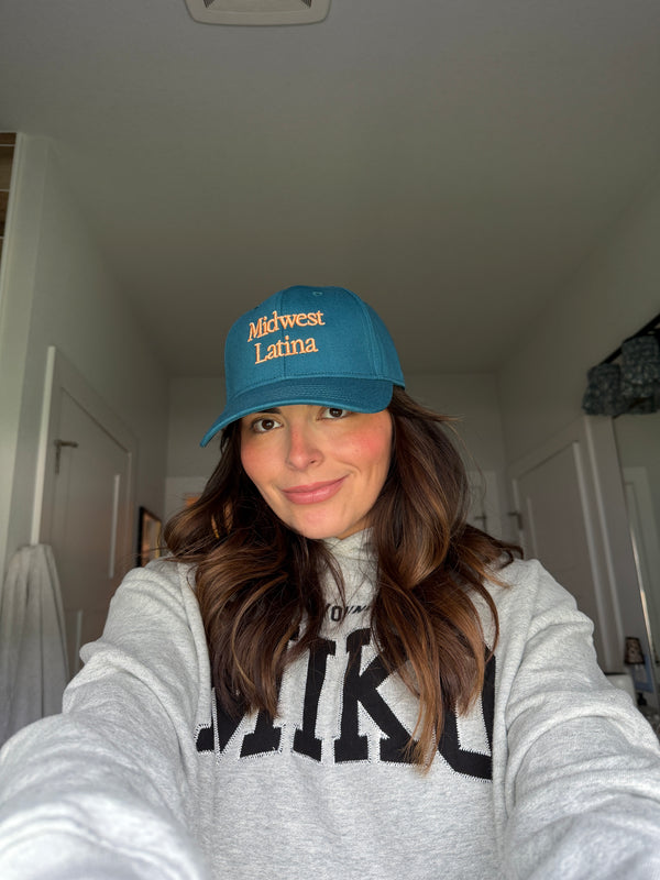 Teal cap with peach logo