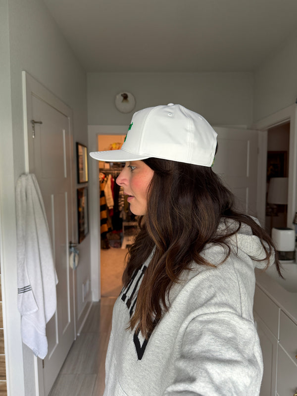 White cap with green logo